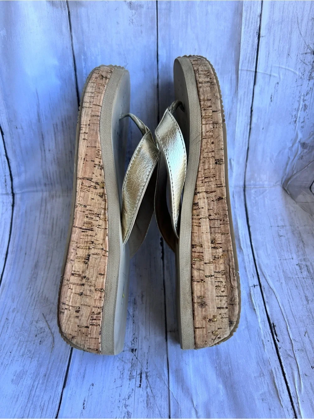 Volatile Gold thong wedge sandals with a cork platform,